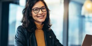 woman at computer smiling