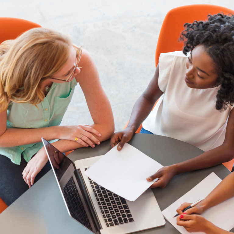 two women working together